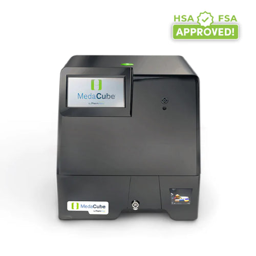 The image shows a MedaCube 2.0 Automatic Pill Dispenser with a black casing, a digital screen, and a drawer on the right side. HSA FSA Approved banner in the upper right